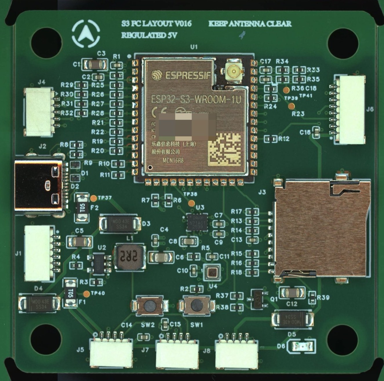 The flight controller: an ESP32-S3 module surrounded by connectors, an SD card slot and power parts on a green board
